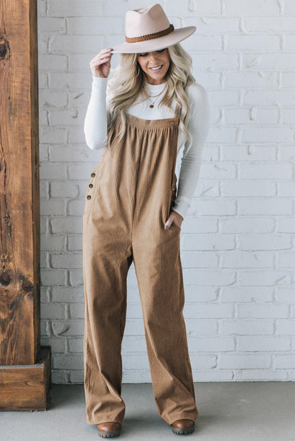 Black solid pocketed loose-fitting corduroy overall.