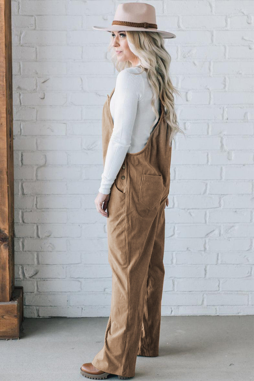 Black solid pocketed loose-fitting corduroy overall.