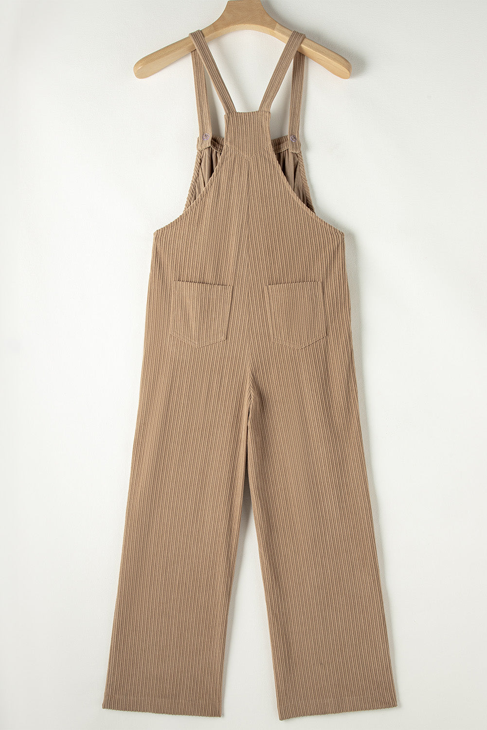 Black solid pocketed loose-fitting corduroy overall.