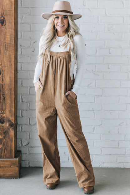 Black solid pocketed loose-fitting corduroy overall.