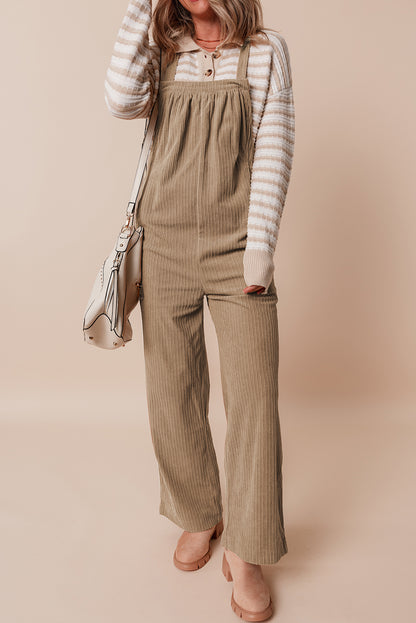 Black solid pocketed loose-fitting corduroy overall.