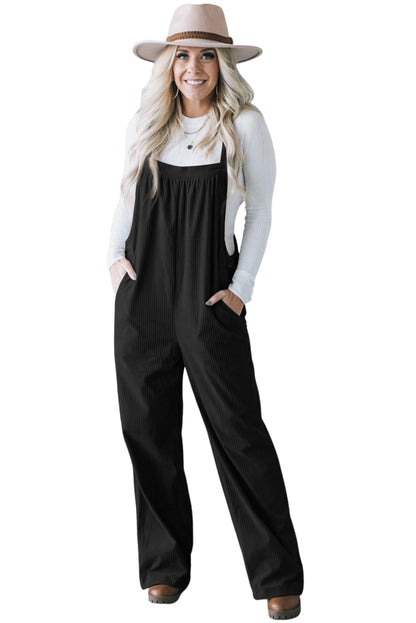 Black solid pocketed loose-fitting corduroy overall.