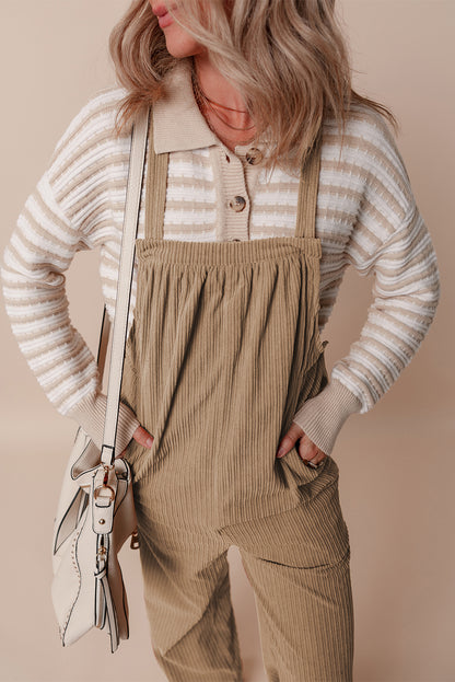 Black solid pocketed loose-fitting corduroy overall.