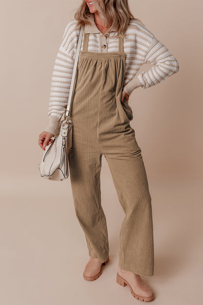 Black solid pocketed loose-fitting corduroy overall.