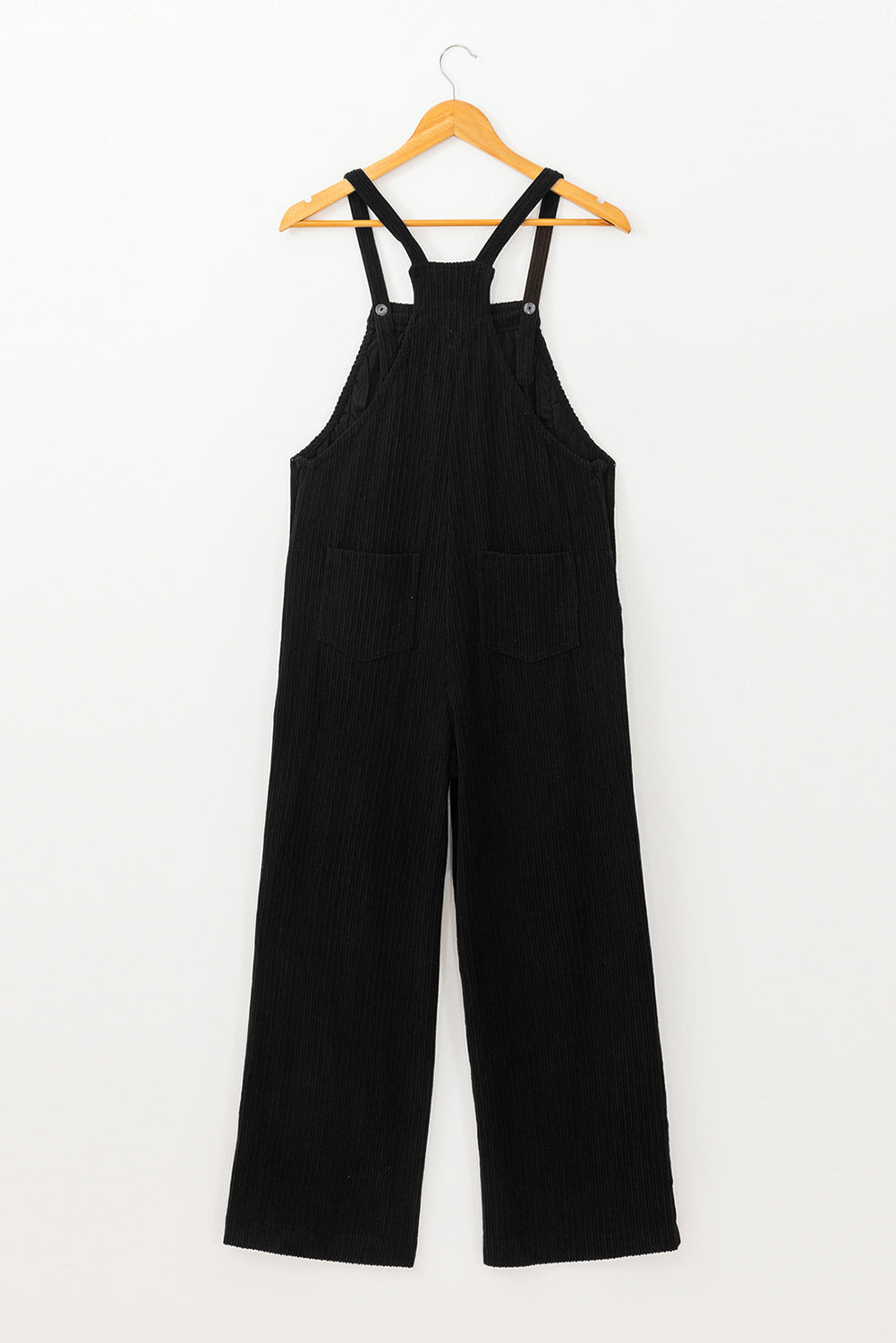 Black solid pocketed loose-fitting corduroy overall.