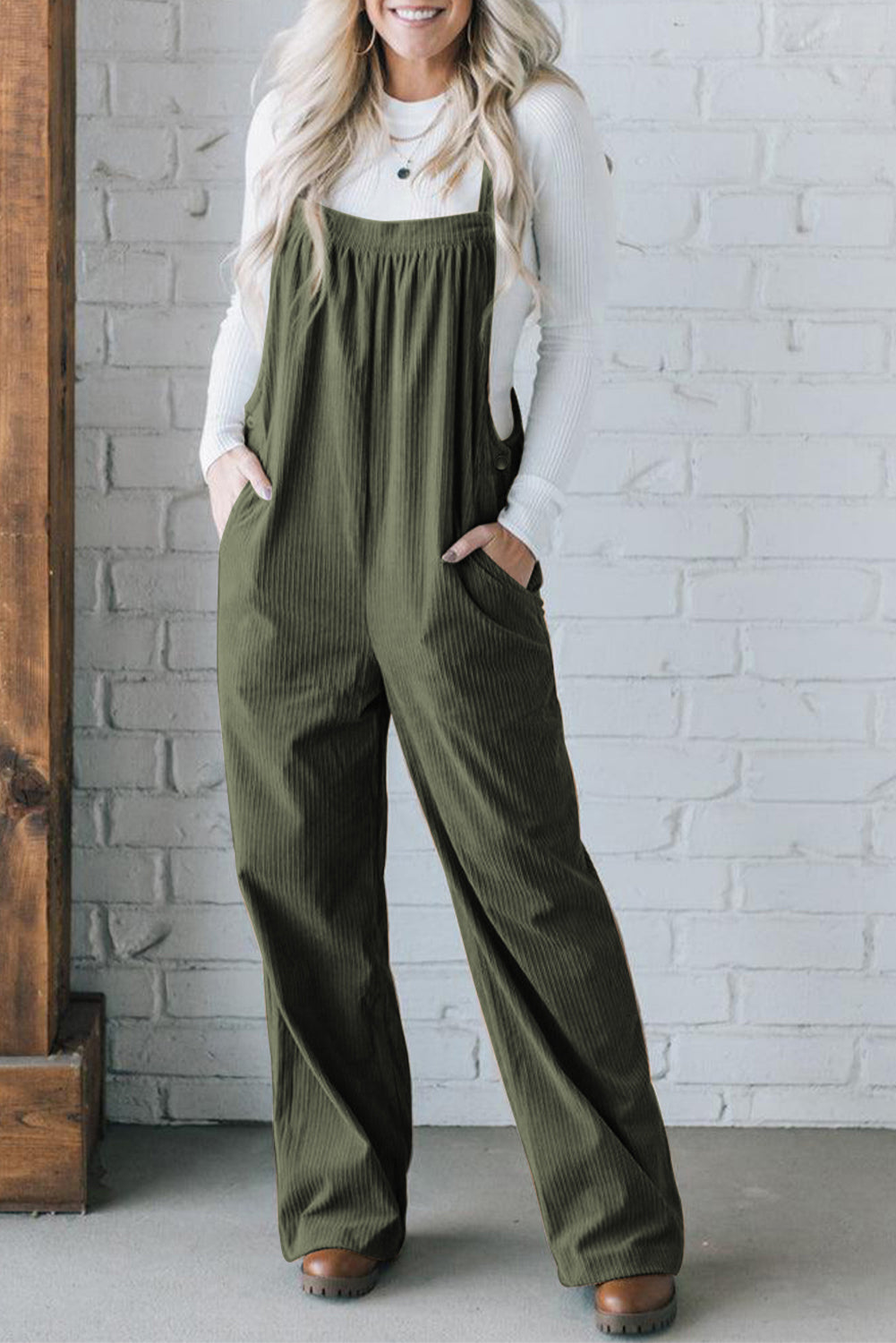 Black solid pocketed loose-fitting corduroy overall.